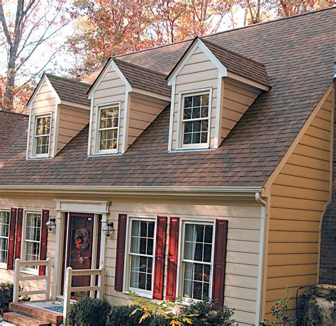 houses with dark brown metal roofs|reddish brown roof house colors.